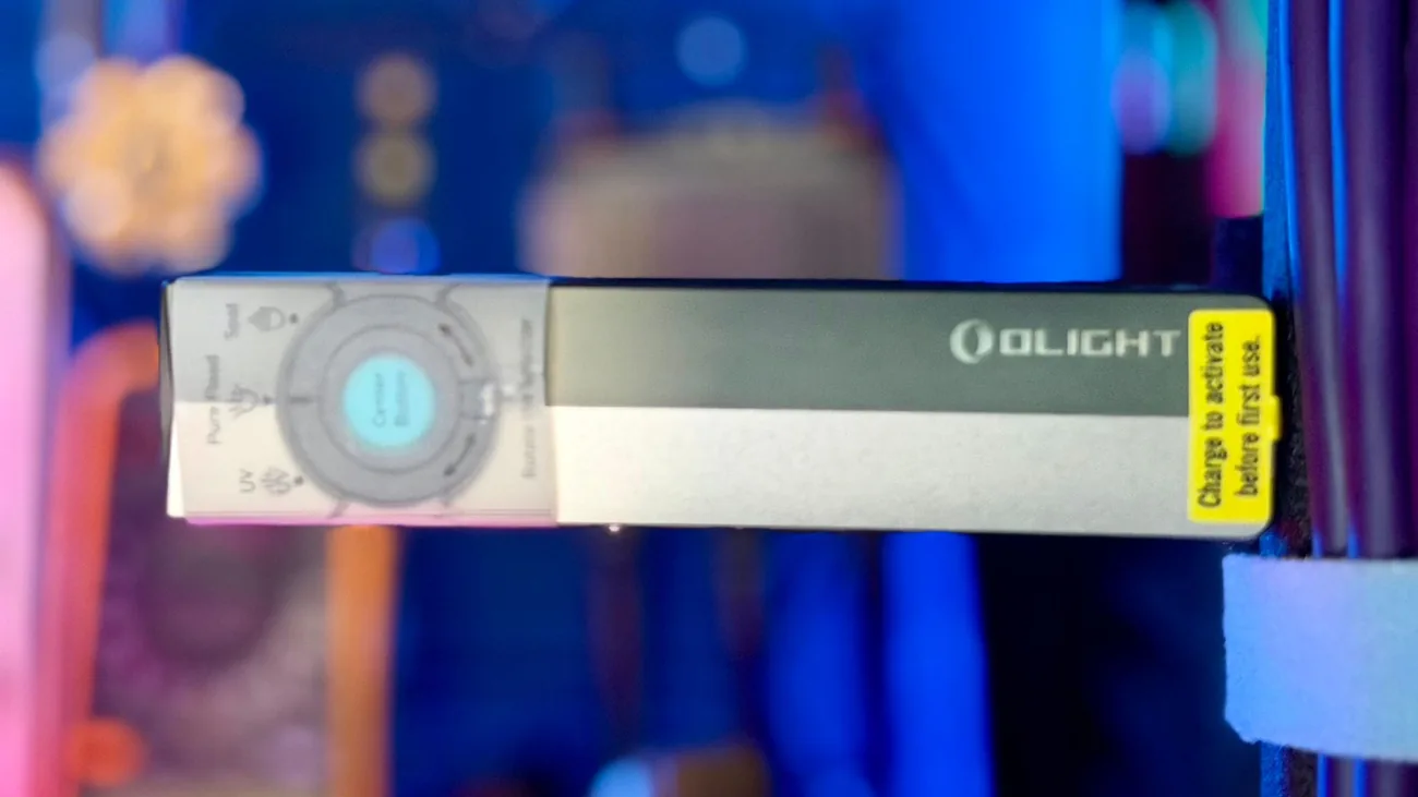 Olight ArkPro in its packaging with the control map, silver graphite unit